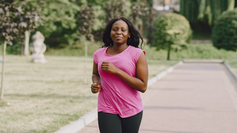 A woman jogging to lose weight