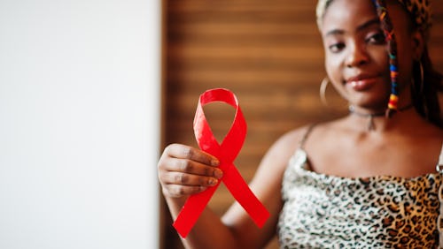 A person showing the HIV symbol