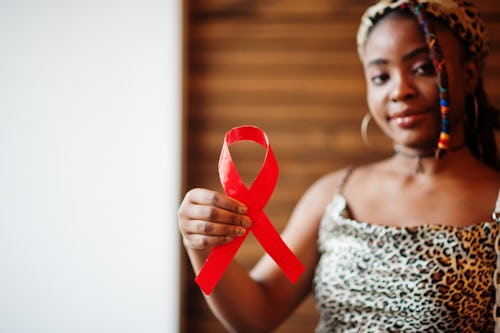 A person showing the HIV symbol