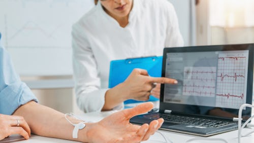 Doctor checking a patient's heart rate