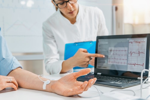 Doctor checking a patient's heart rate