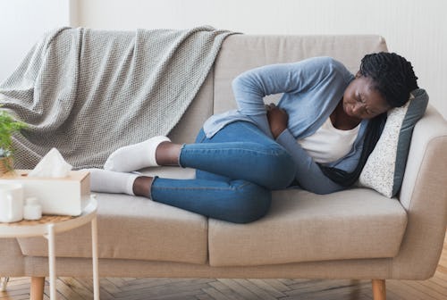 Black girl experiencing period cramp