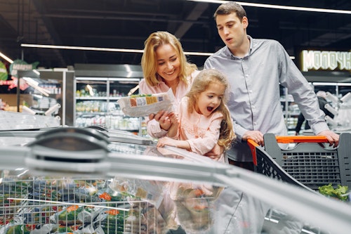 A couple buying frozen food from a grocery store