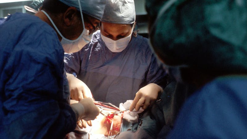 Surgeons doing a surgery to remove metastatic tumor in the brain