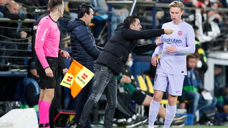  Frenkie de Jong receiving instructions from Barcelona manager Xavi