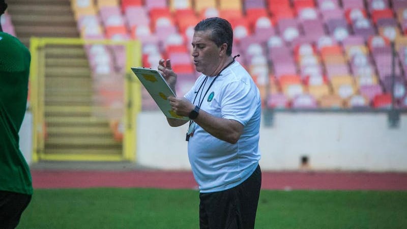 Portueguese manager, Jose Peseiro of Nigeria, takes note during training