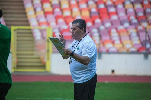 Portueguese manager, Jose Peseiro of Nigeria, takes note during training