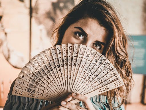 Mediterranean woman with a fan