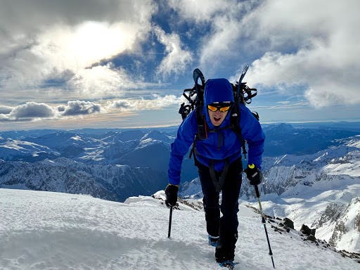 A man climbing a snow-covered mountain in the Pyrenees 