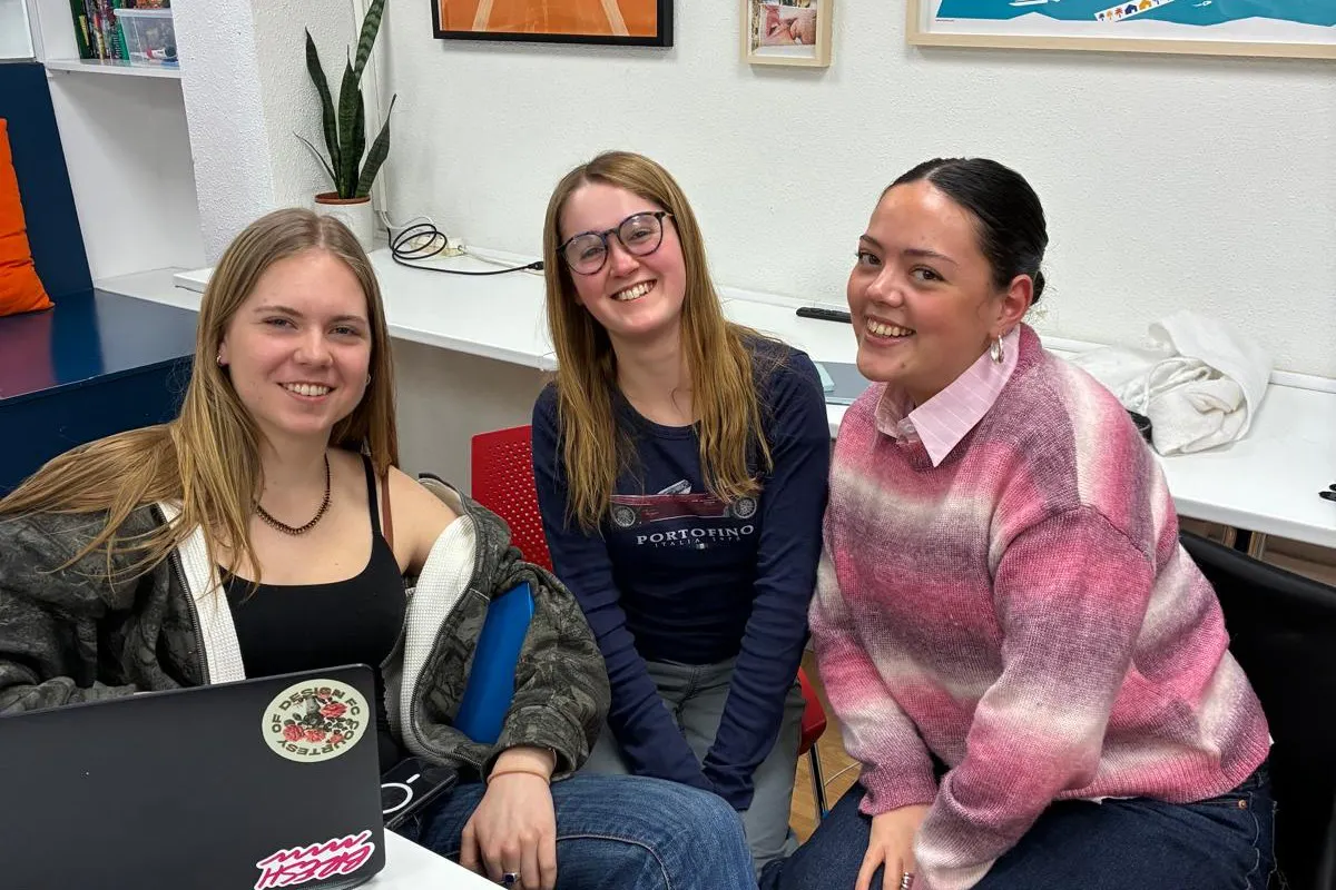Millie with two other gap year students at the school in Barcelona