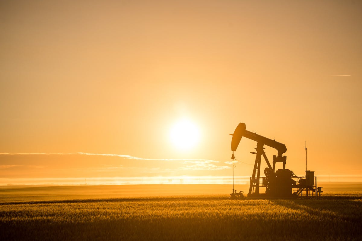 Oil equipment, backlit by a sunset.