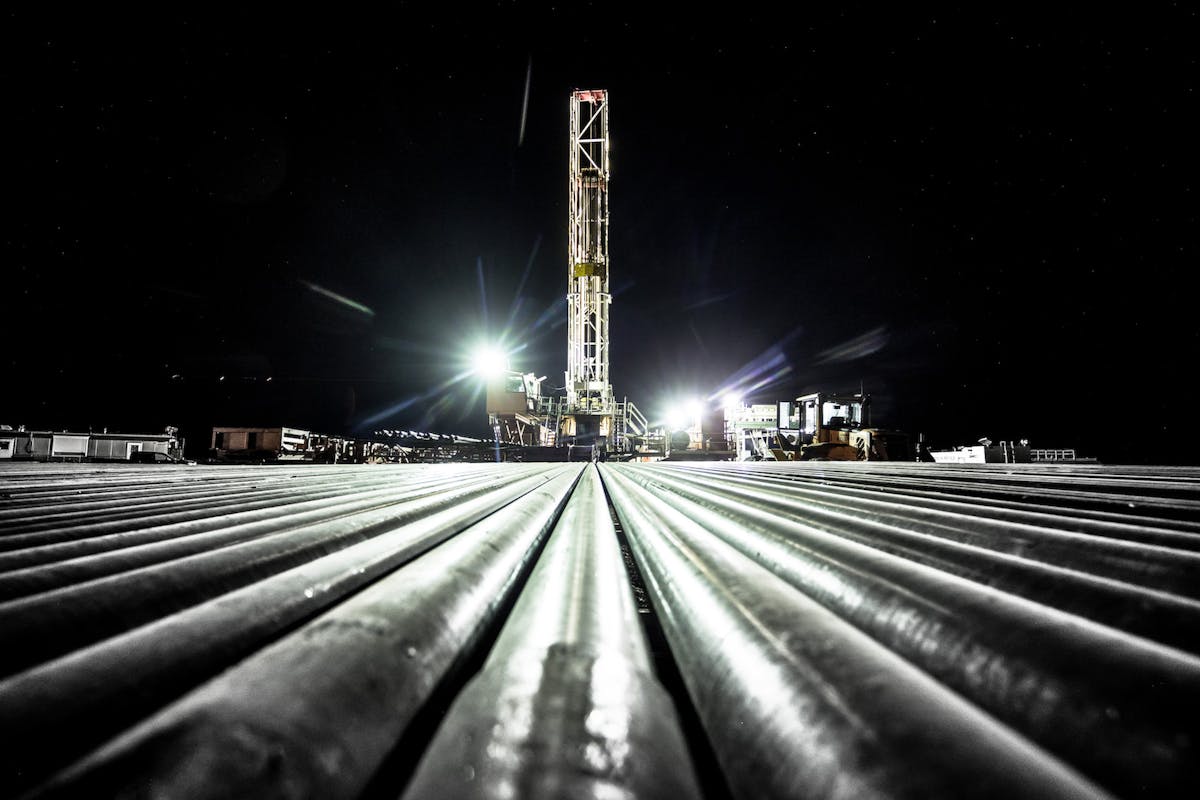Oil rig machinery at night.