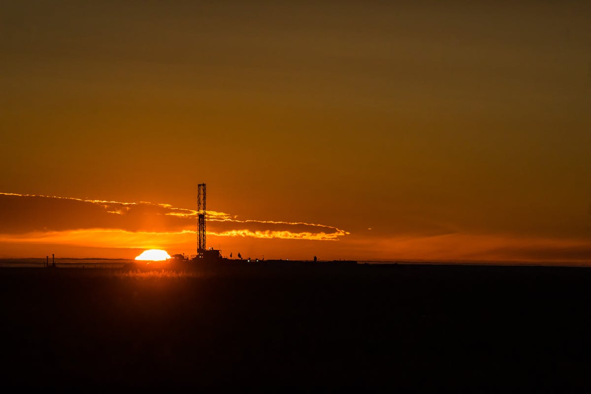 An oil rig at sunset.