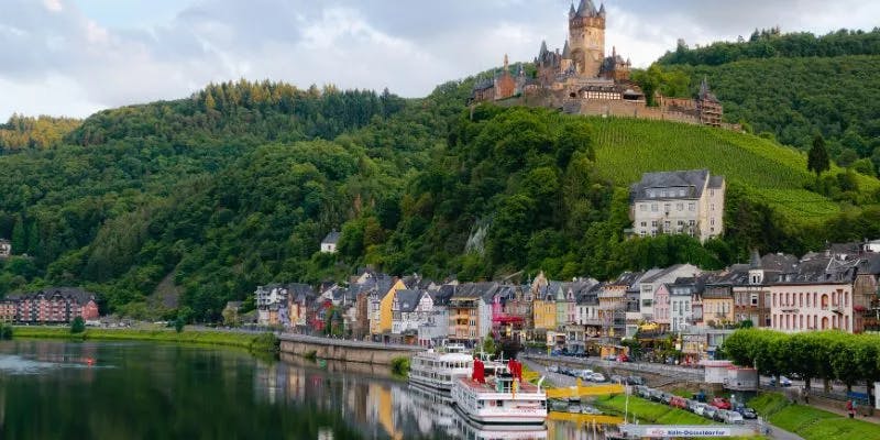 Historic German castle overlooking riverfront village and vineyards