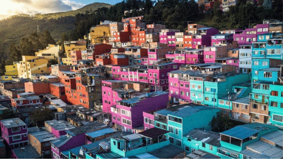 Colorful hillside houses in a vibrant neighborhood.