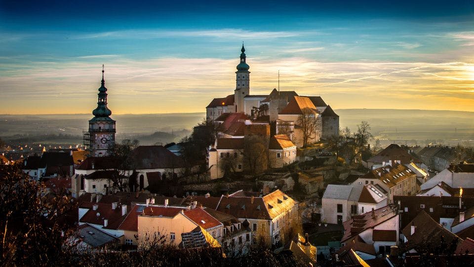 Sunset over historic Czech town and castle