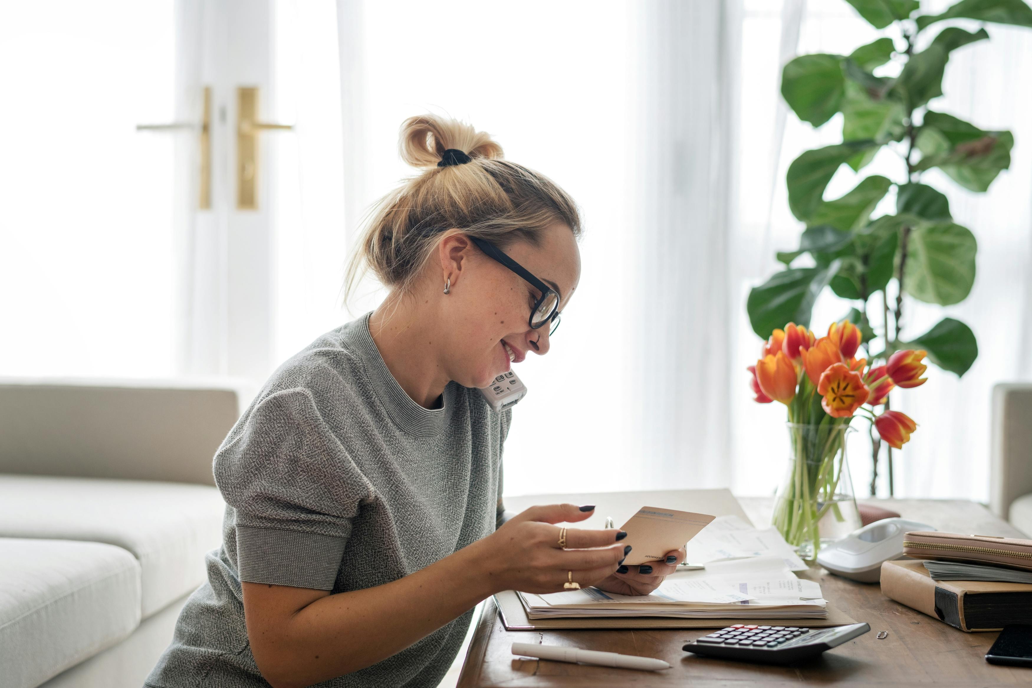 woman on the phone doing her taxes