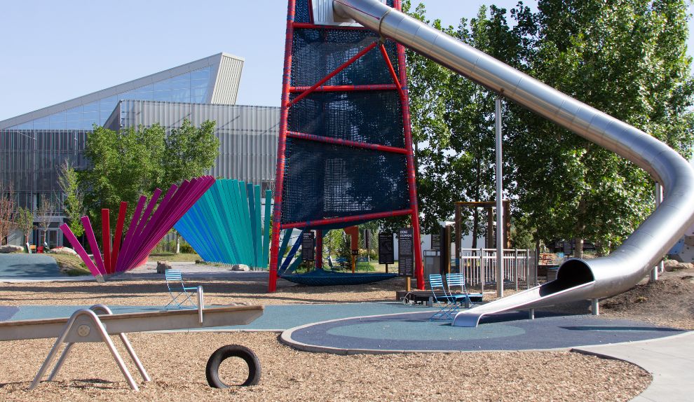 A 63-foot tower slide and 6-person teeter-totter in the Brainasium Outdoor Park at TELUS Spark Science Centre.