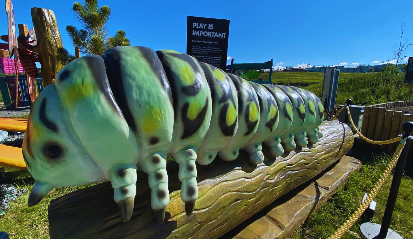A giant fake caterpillar at TELUS Spark