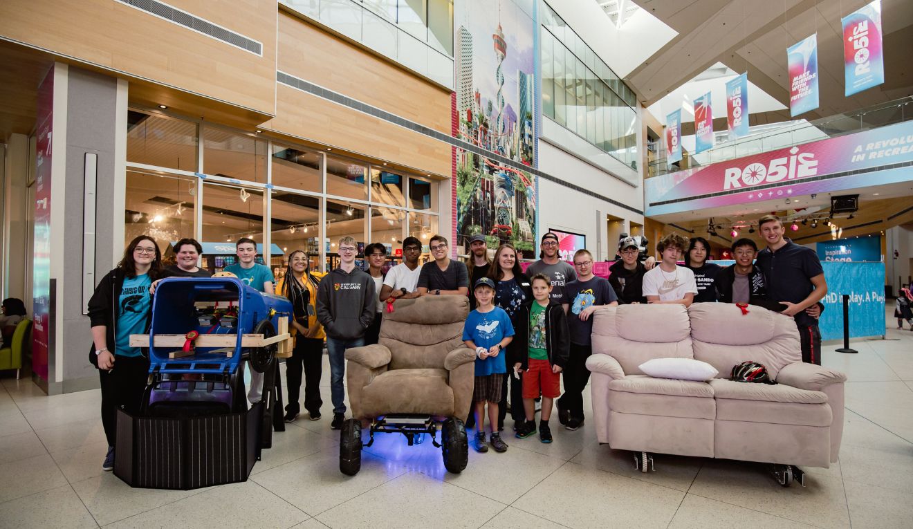 Beakerhead Hack the House program. Kids stand behind their household creations.