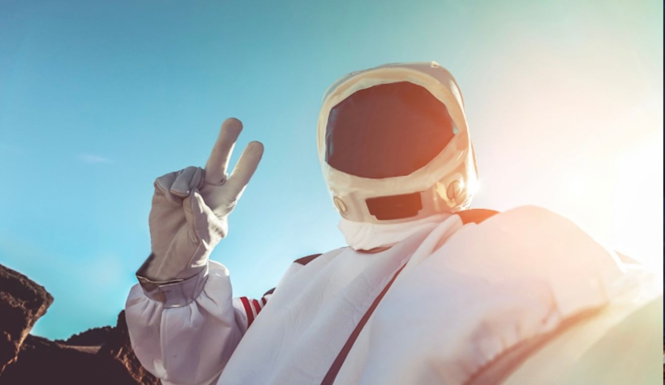 Beakerhead astronaut gives the peace sign.
