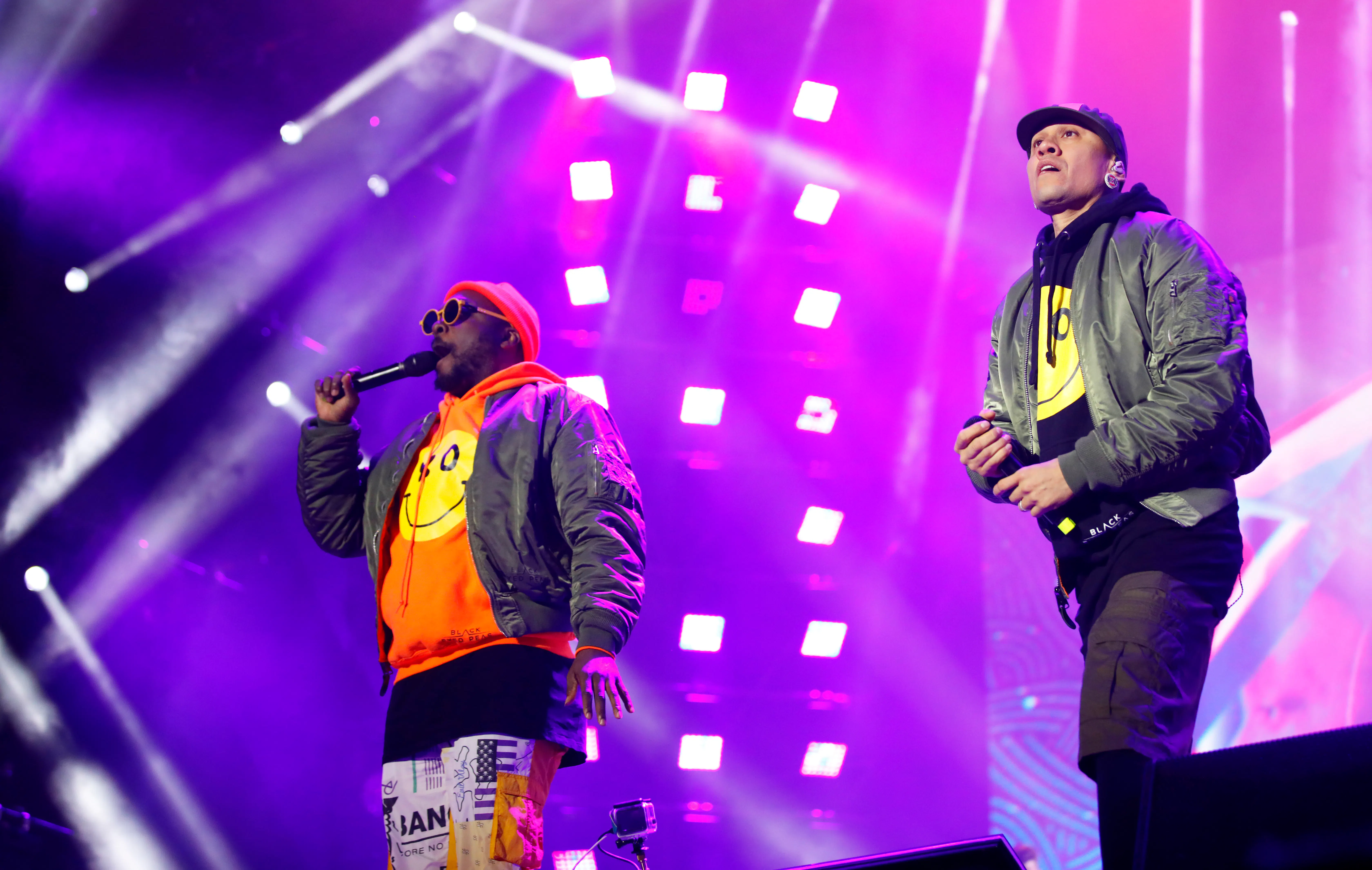 Two artists performing live at Atlas Weekend against a purple LED backdrop