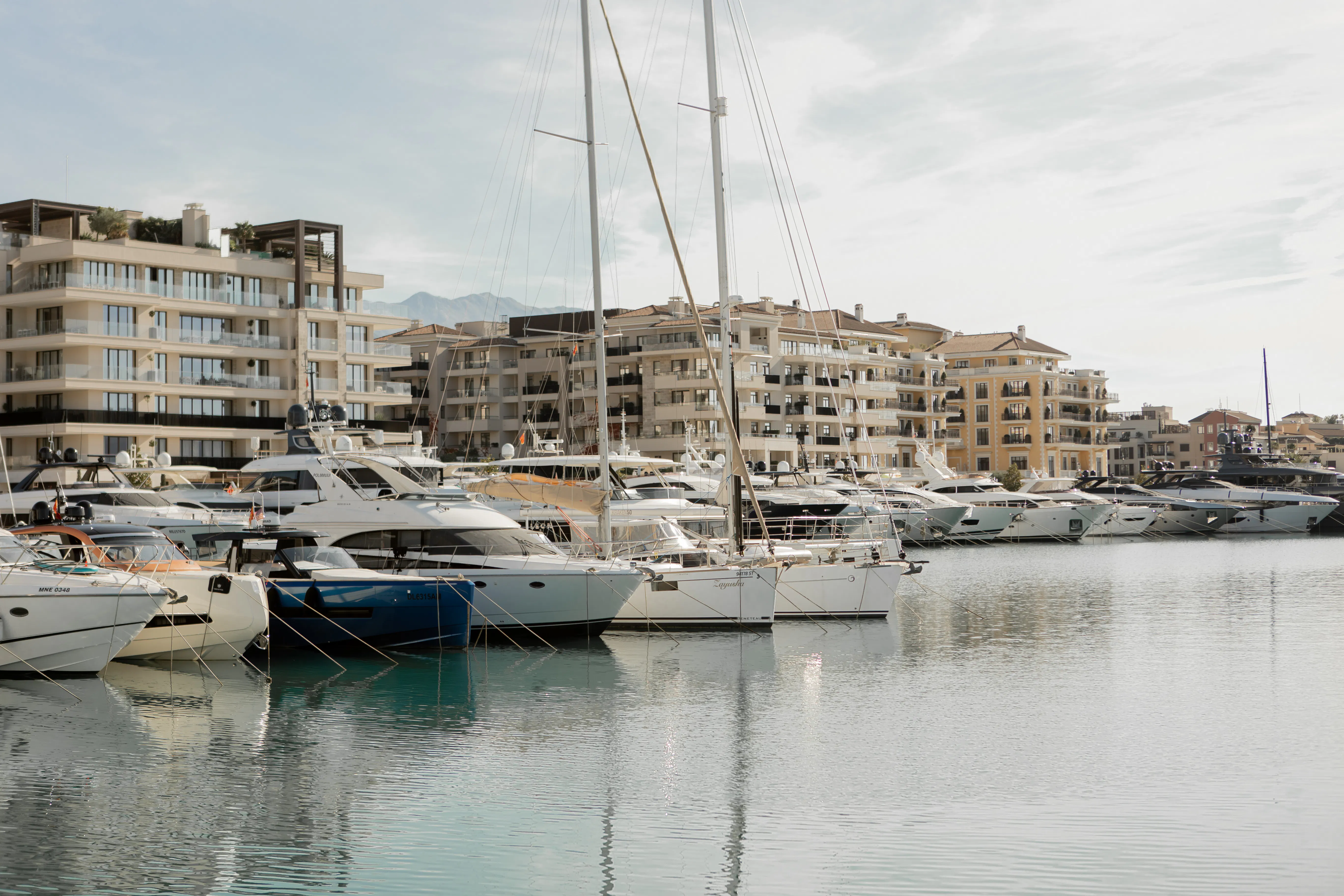 Yachts and sailboats moored in a marina on the Bay of Kotor, Montenegro