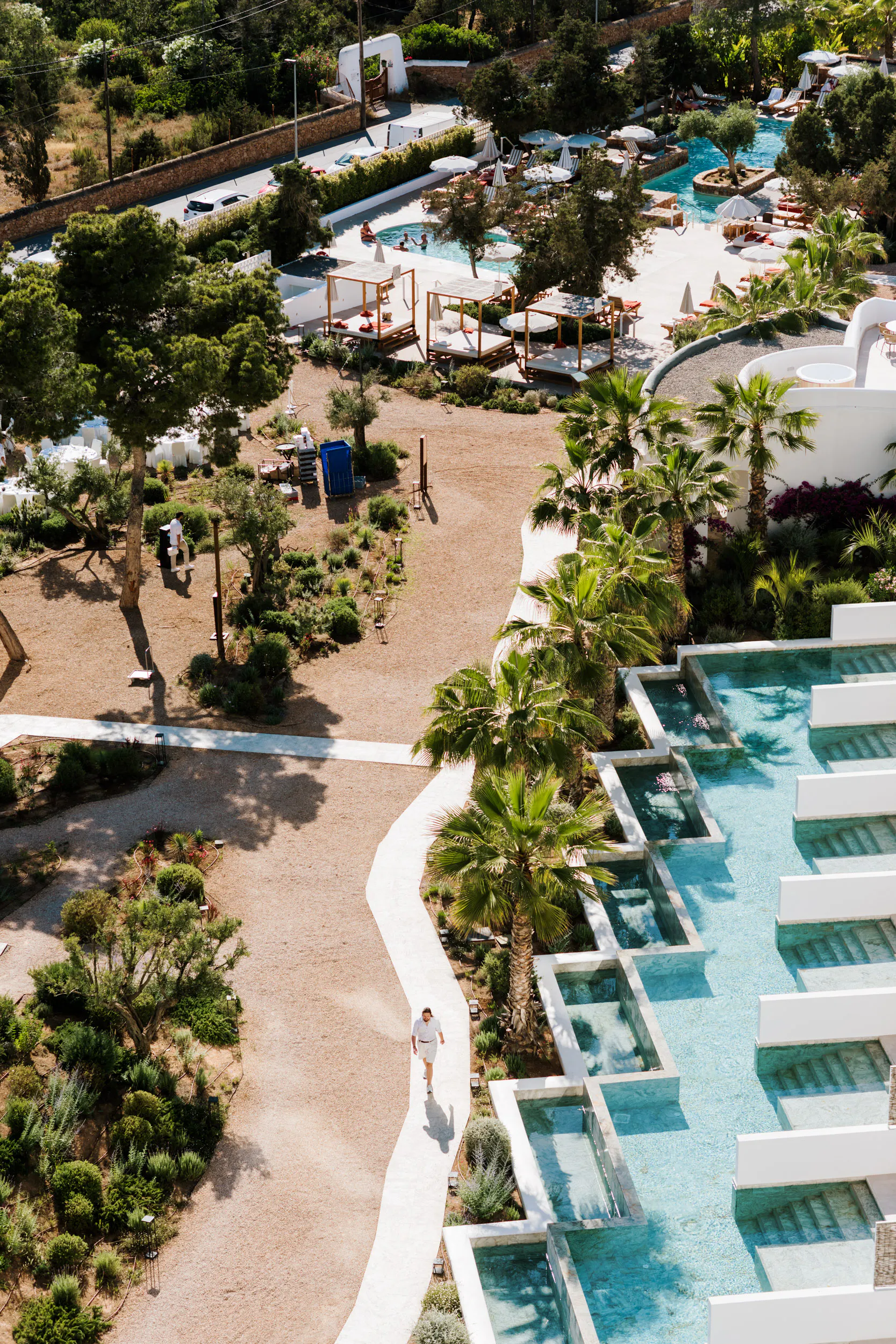 Aerial view of the 5-star Ibiza hotel gardens and cascading pools hosting the Fortunate Media event