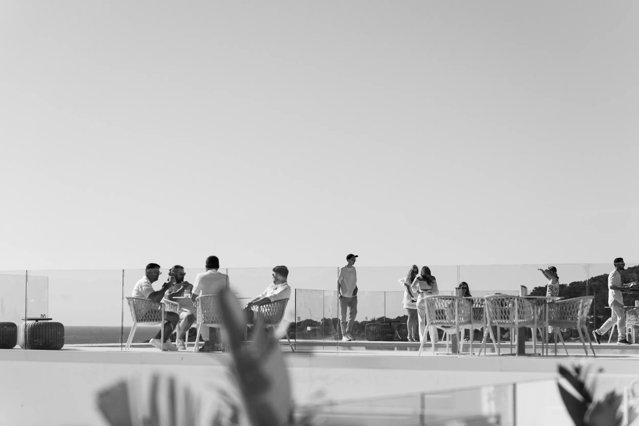 Fortunate Media guests in all-white attire on the panoramic hotel terrace in Ibiza