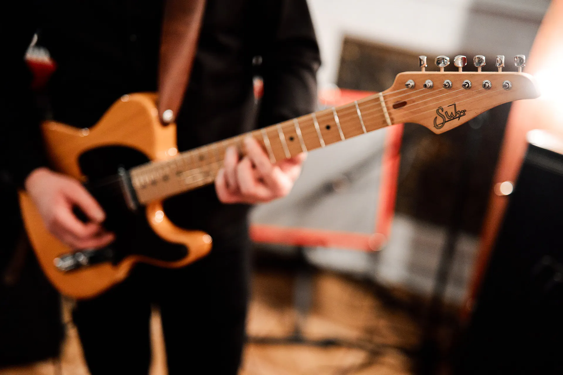 Close-up of a guitarist playing an electric guitar during the Masterday live music program