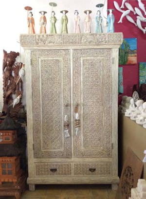 Closet with detailed wood carvings