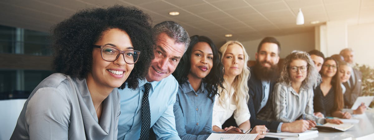 Different team members around a table at work