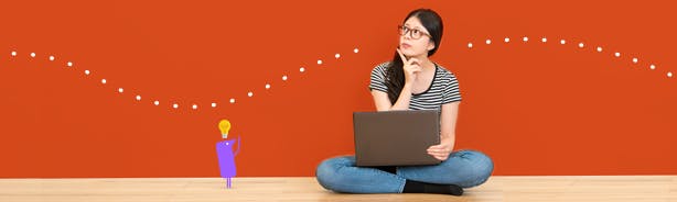 A woman sitting at her laptop with a puzzled look on her face