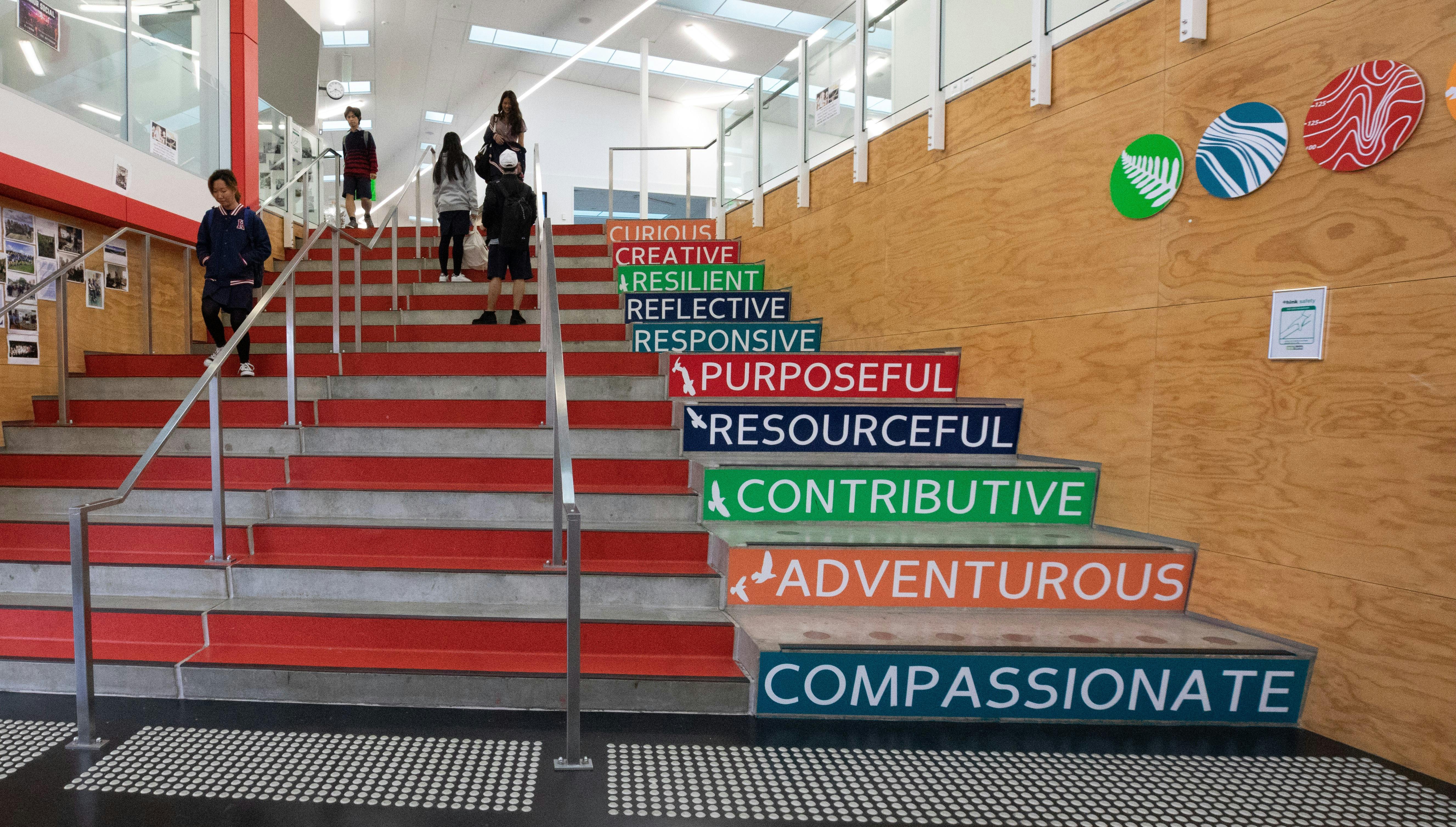 Stairs within Hobsonville Point Secondary School that display their key values