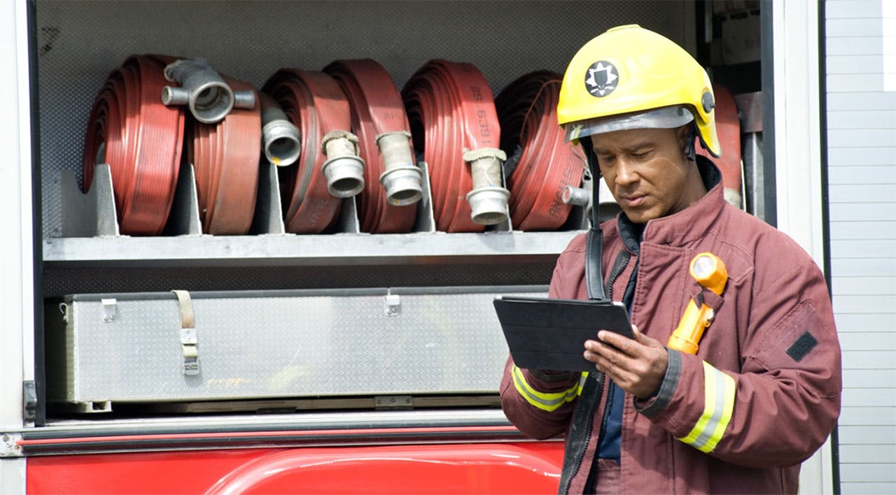 Firefighter using tablet