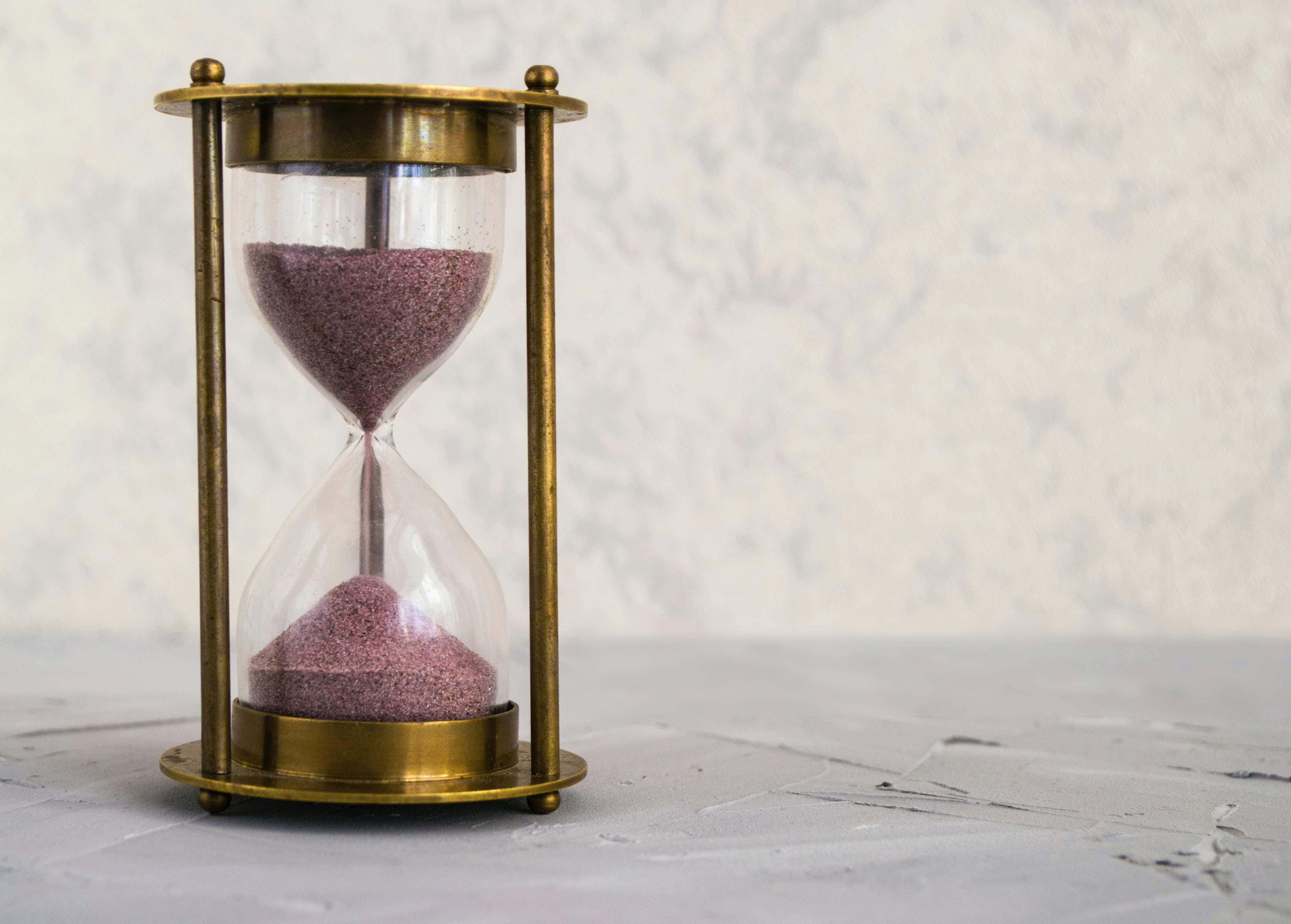 a picture of a gold hourglass for time management 