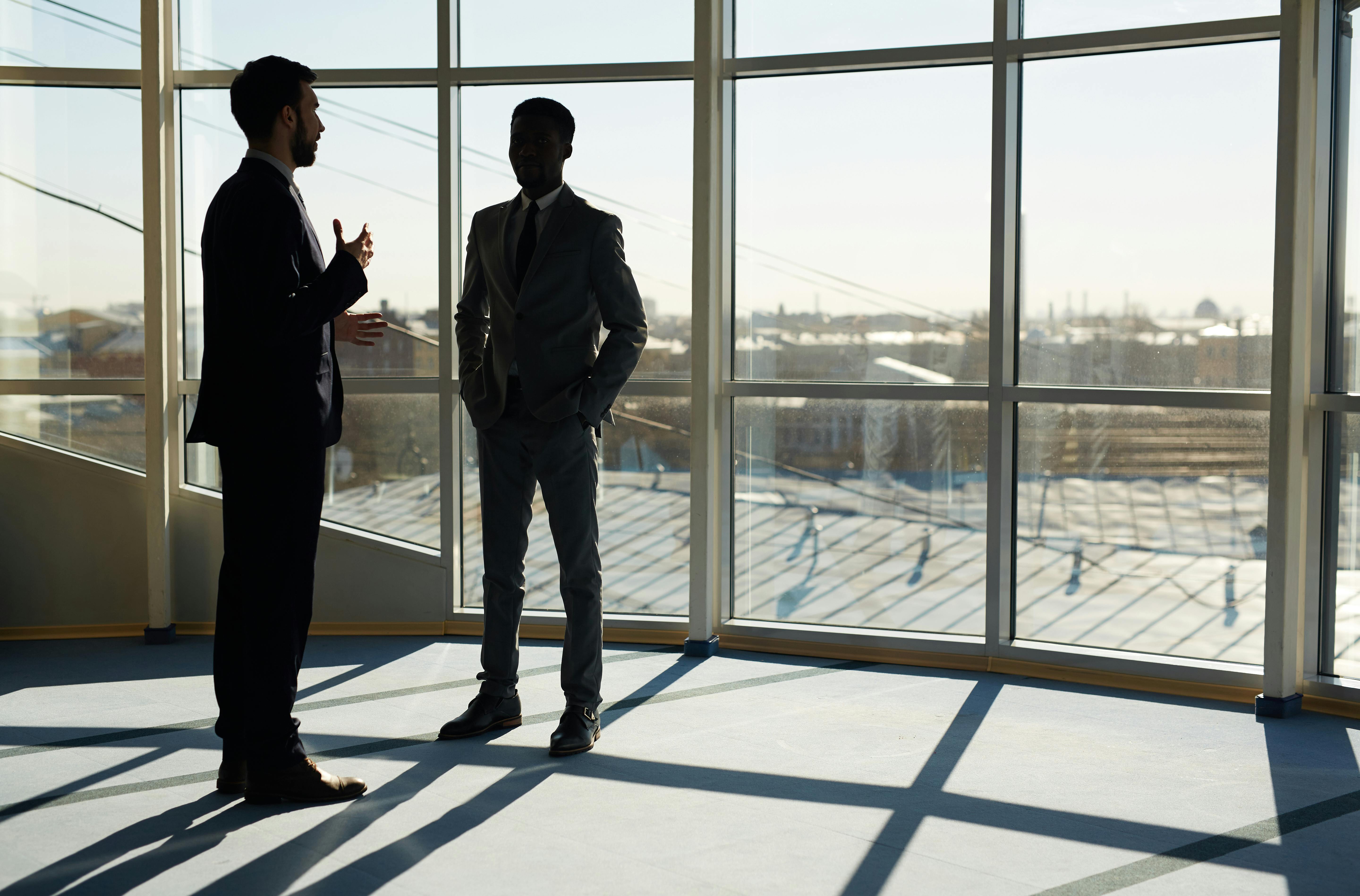 2 businessmen talking and discussing about ideas