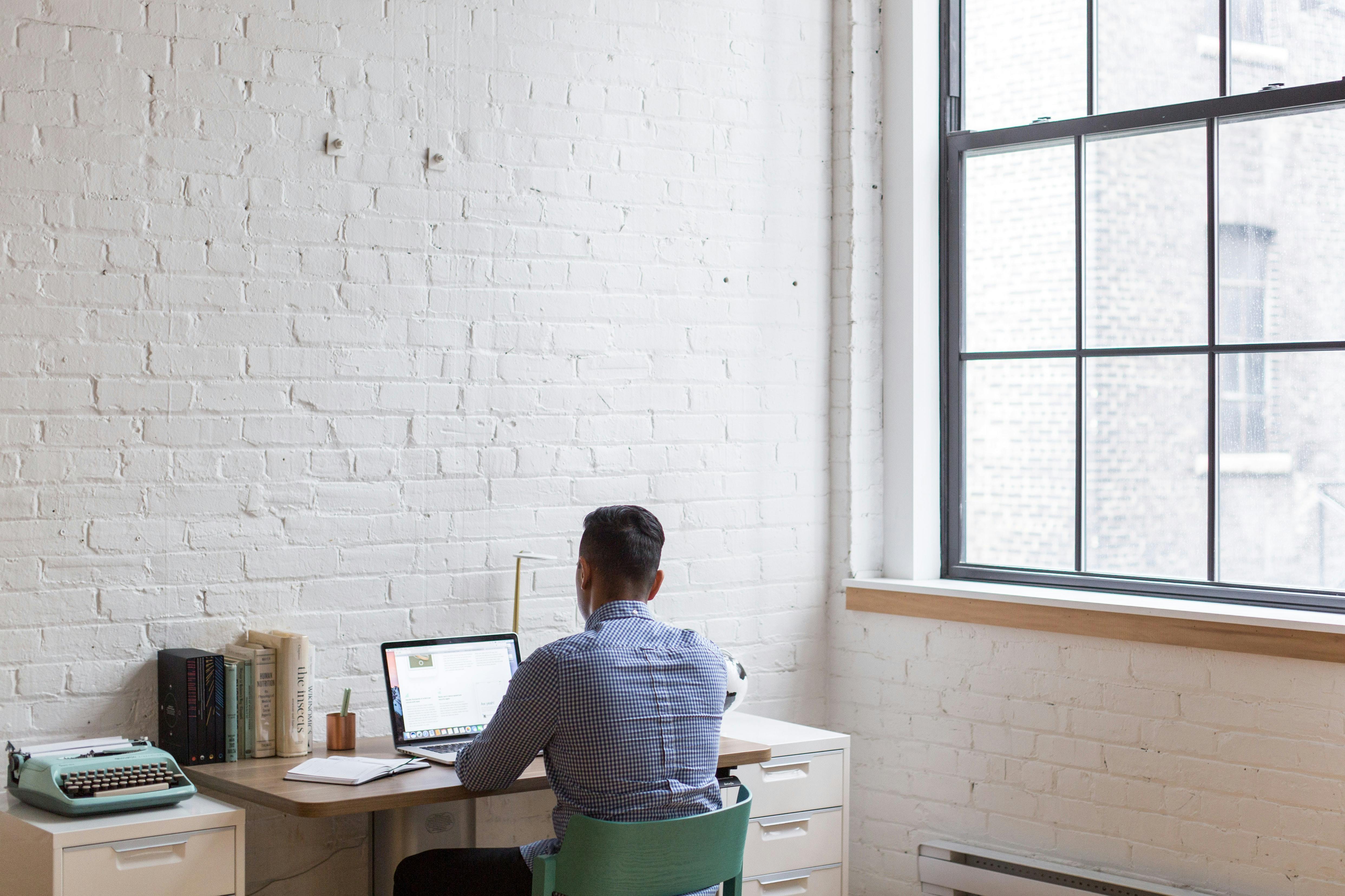 an entrepreneur is working on his desktop