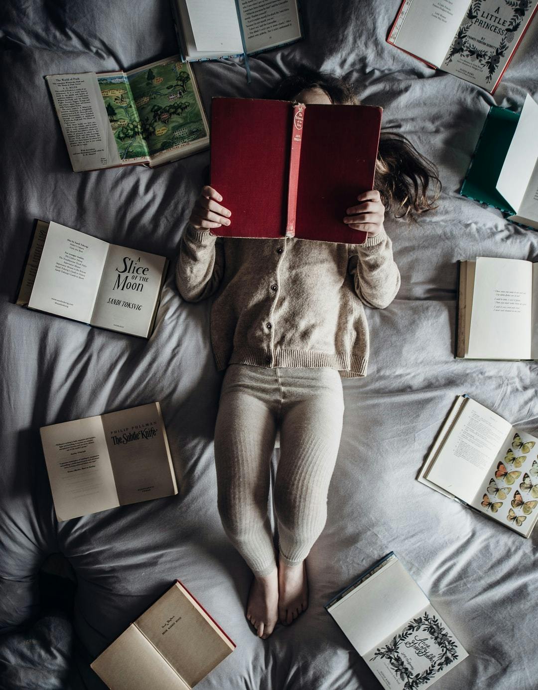 a baby is reading books