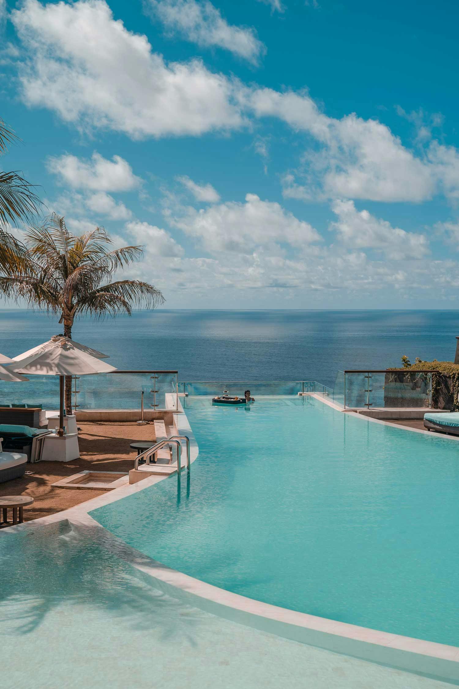 Luxurious 5-star hotel in Uluwatu, Bali with glass-bottom sky pool over the ocean