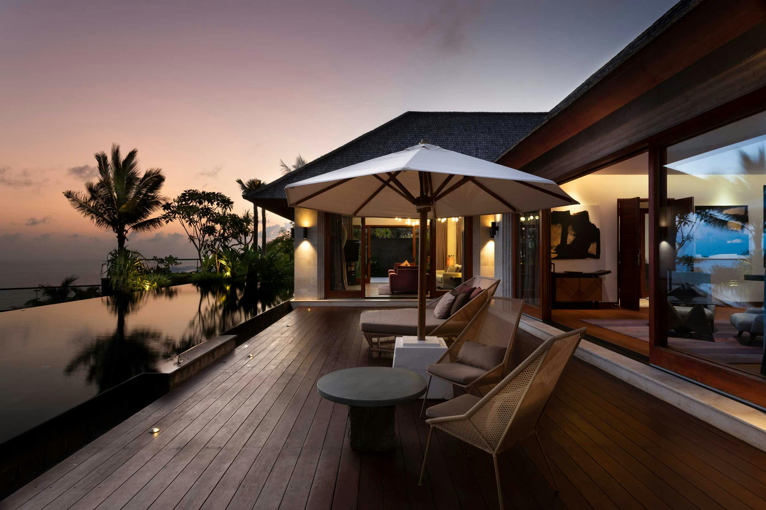 The outside of a luxurious villa in Uluwatu bali at sunset