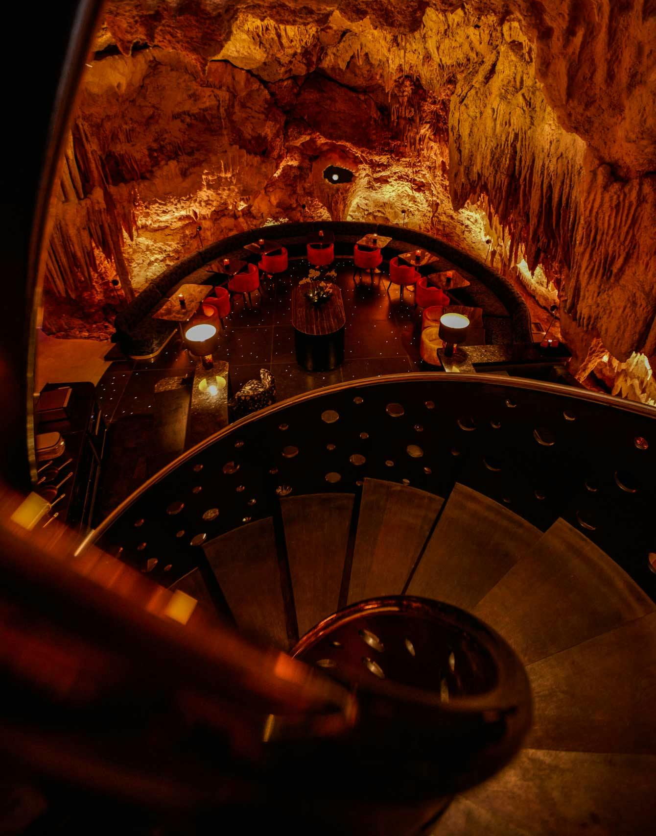 A subterranean restaurant located inside a real cave located in Uluwatu, Bali