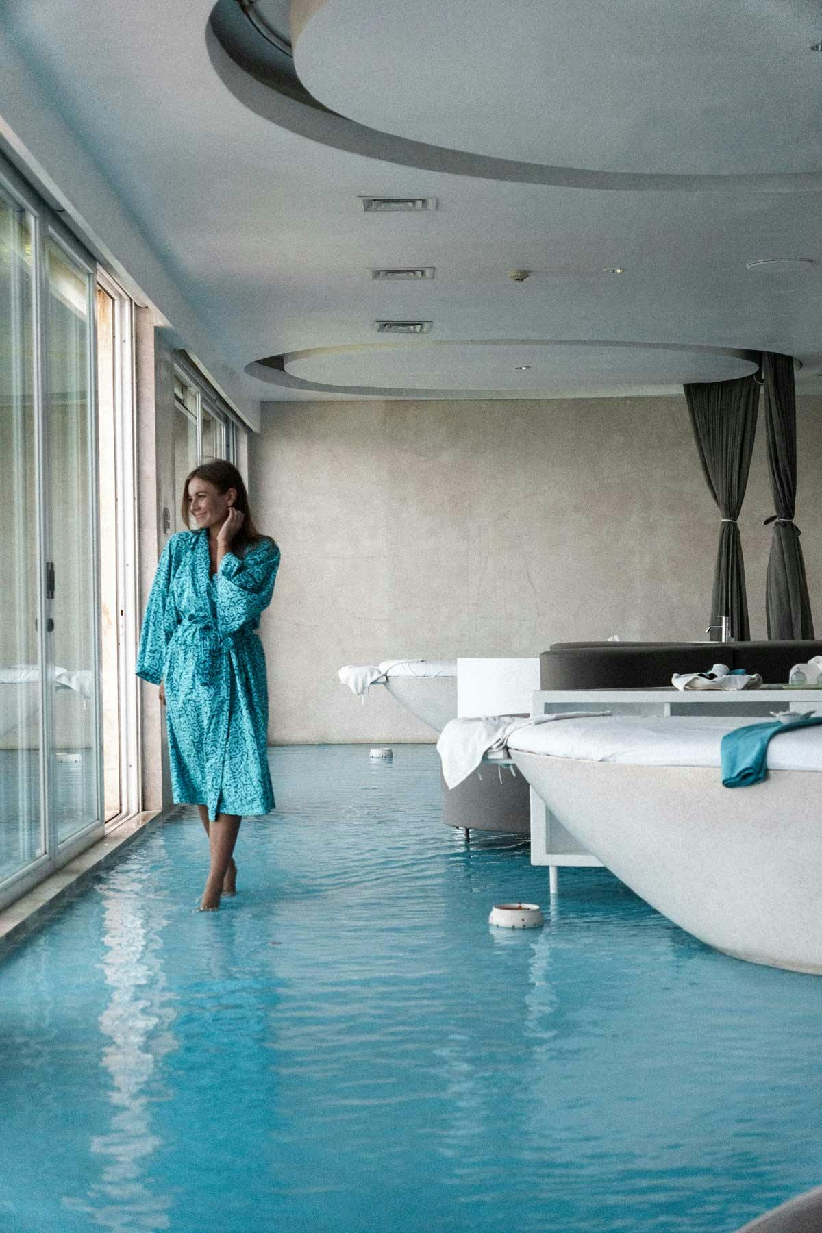woman standing looking out at the view in luxurious spa in Bali