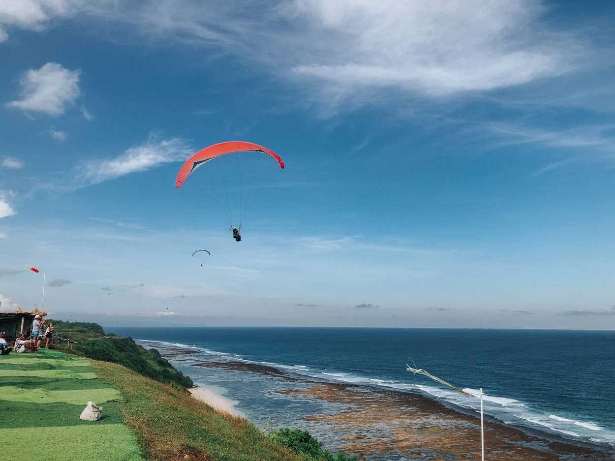 Soar over Bali’s stunning coastline and take in breathtaking aerial views.