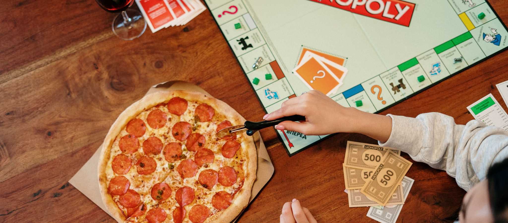 Pizza being cut with a pizza cutter