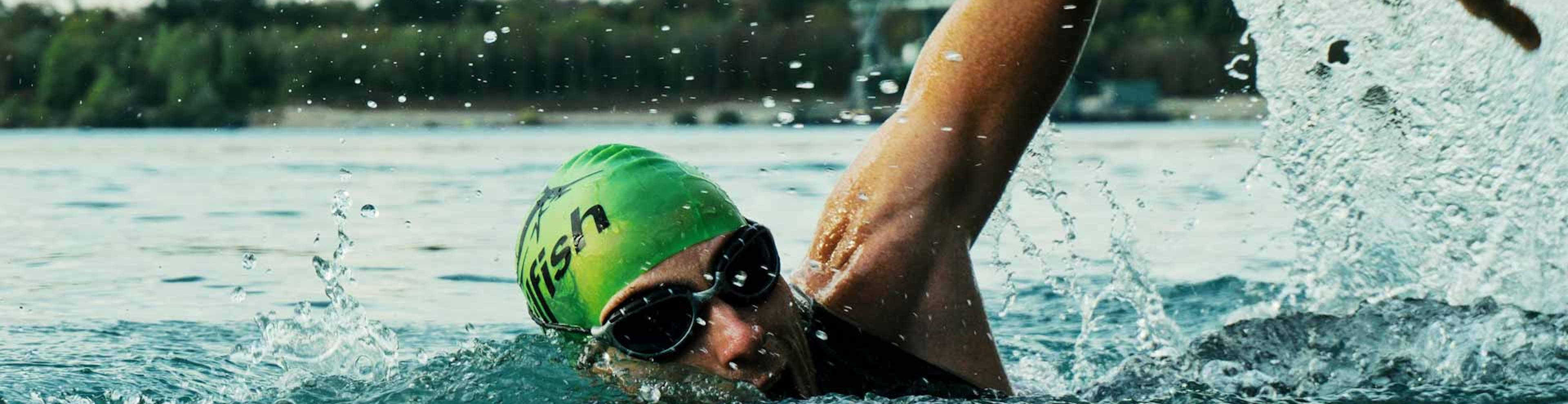 man swimming competitively