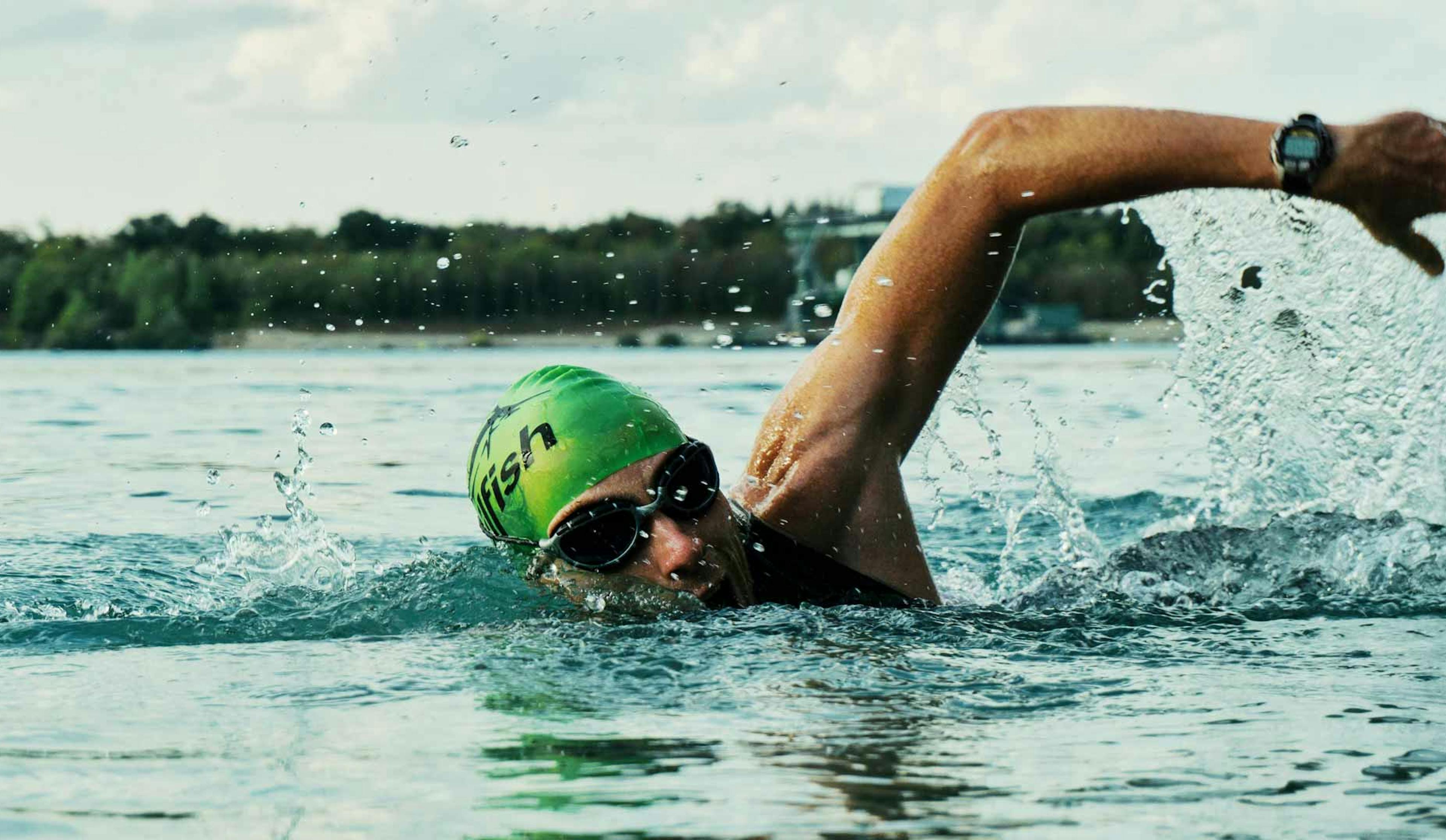 man swimming competitively