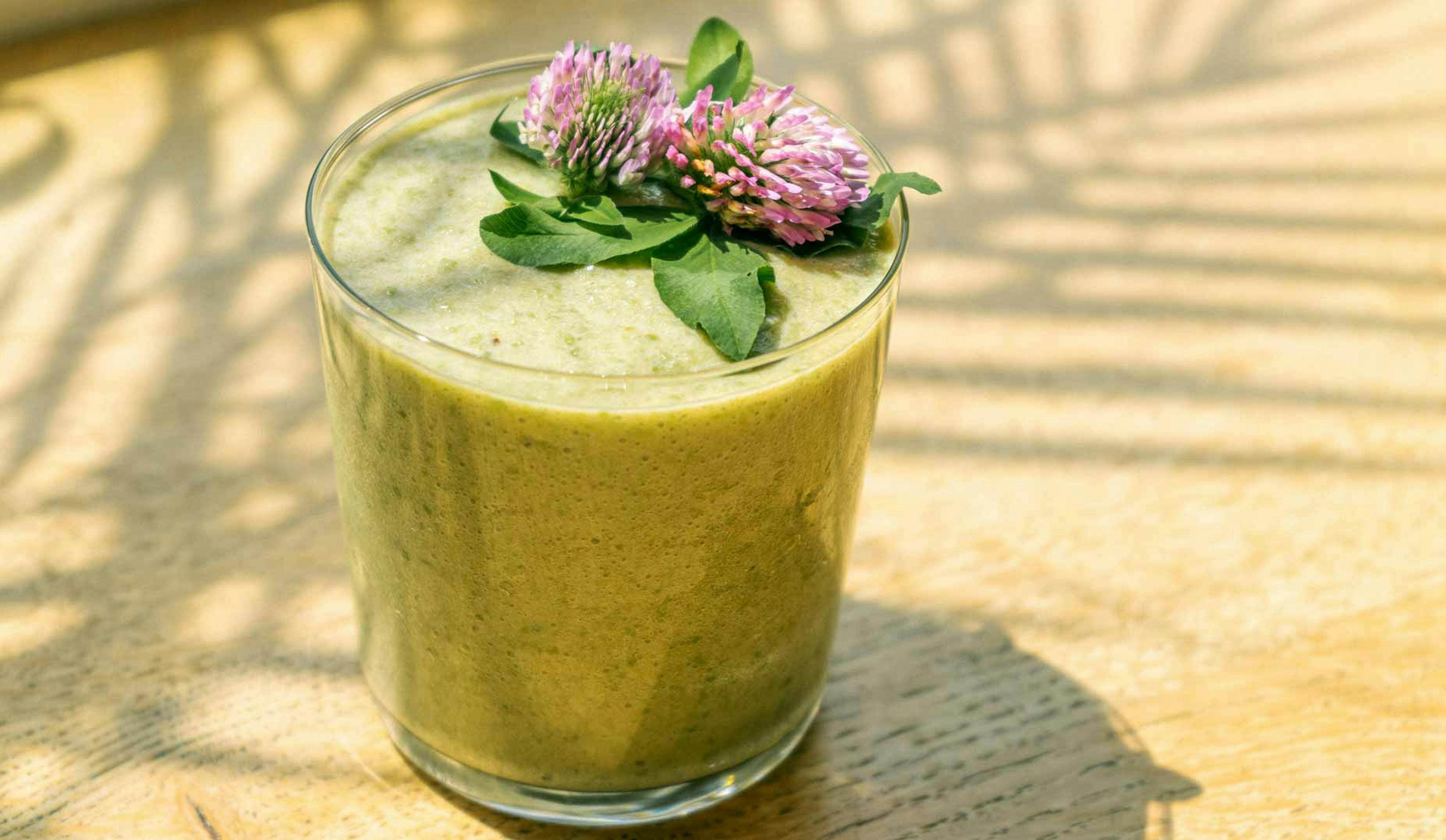 green smoothie with flower on top