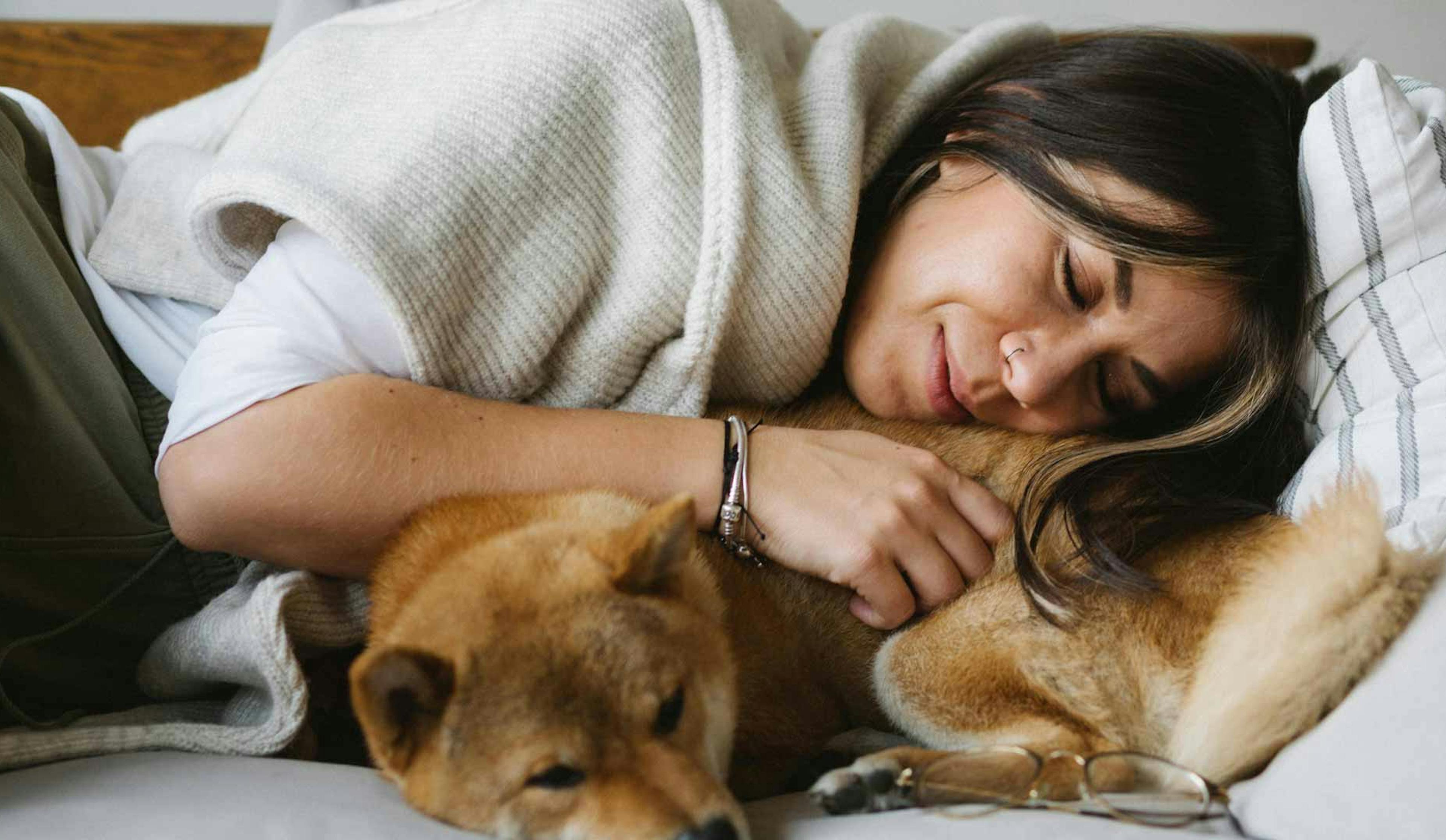 woman asleep with dog