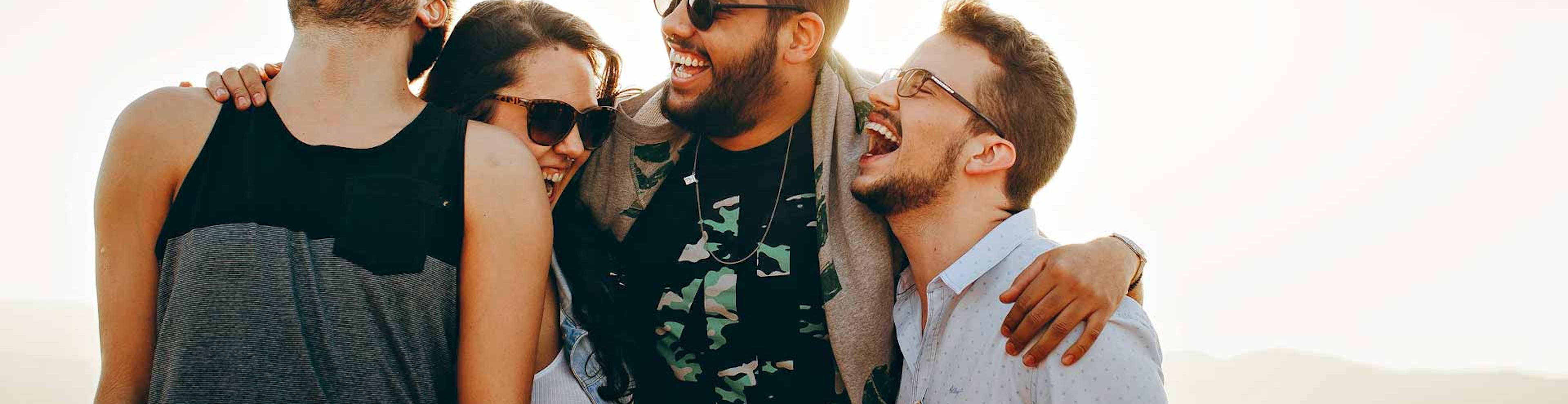 four friends laughing